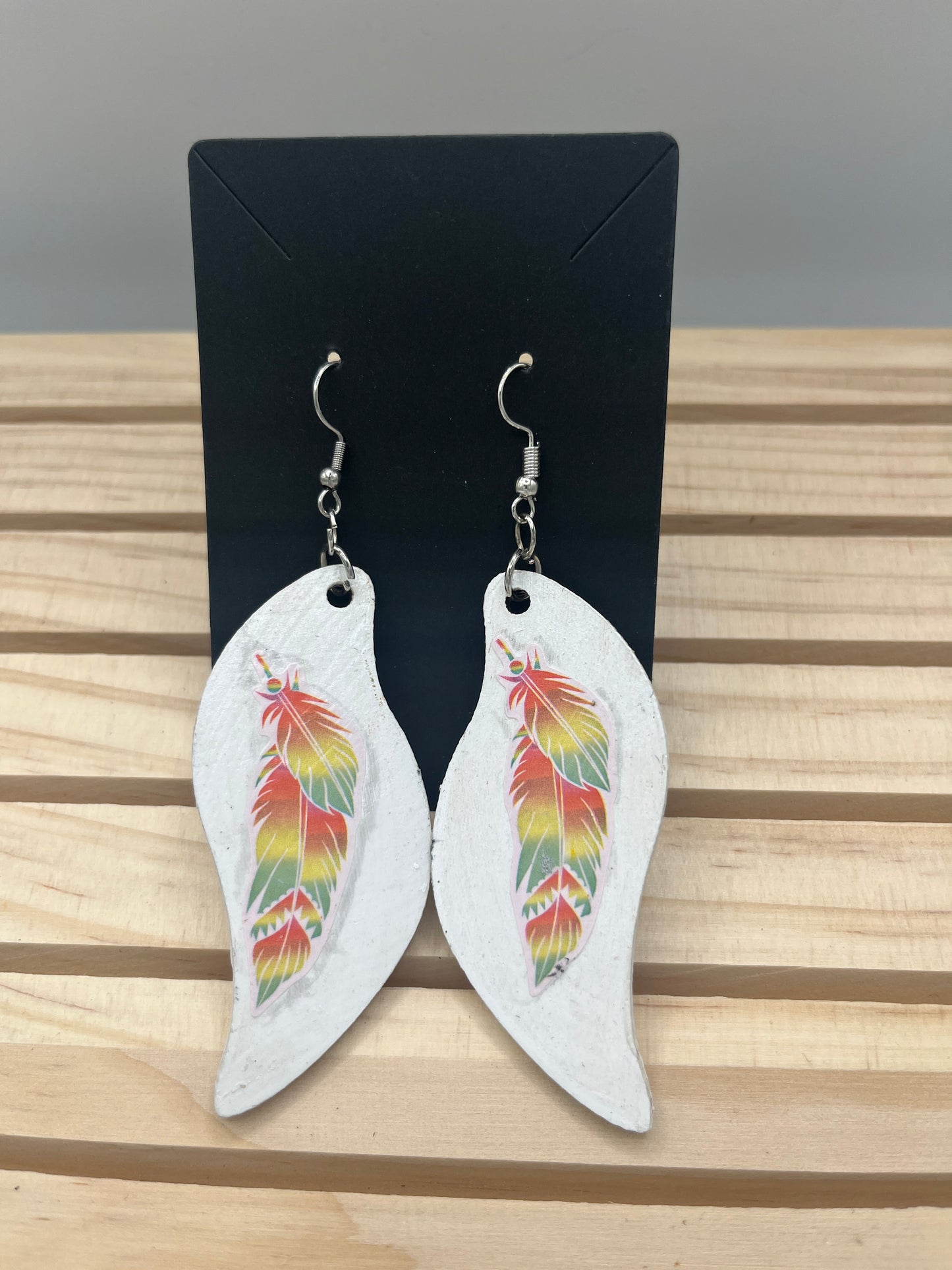 Wave earrings with multi colored feathers