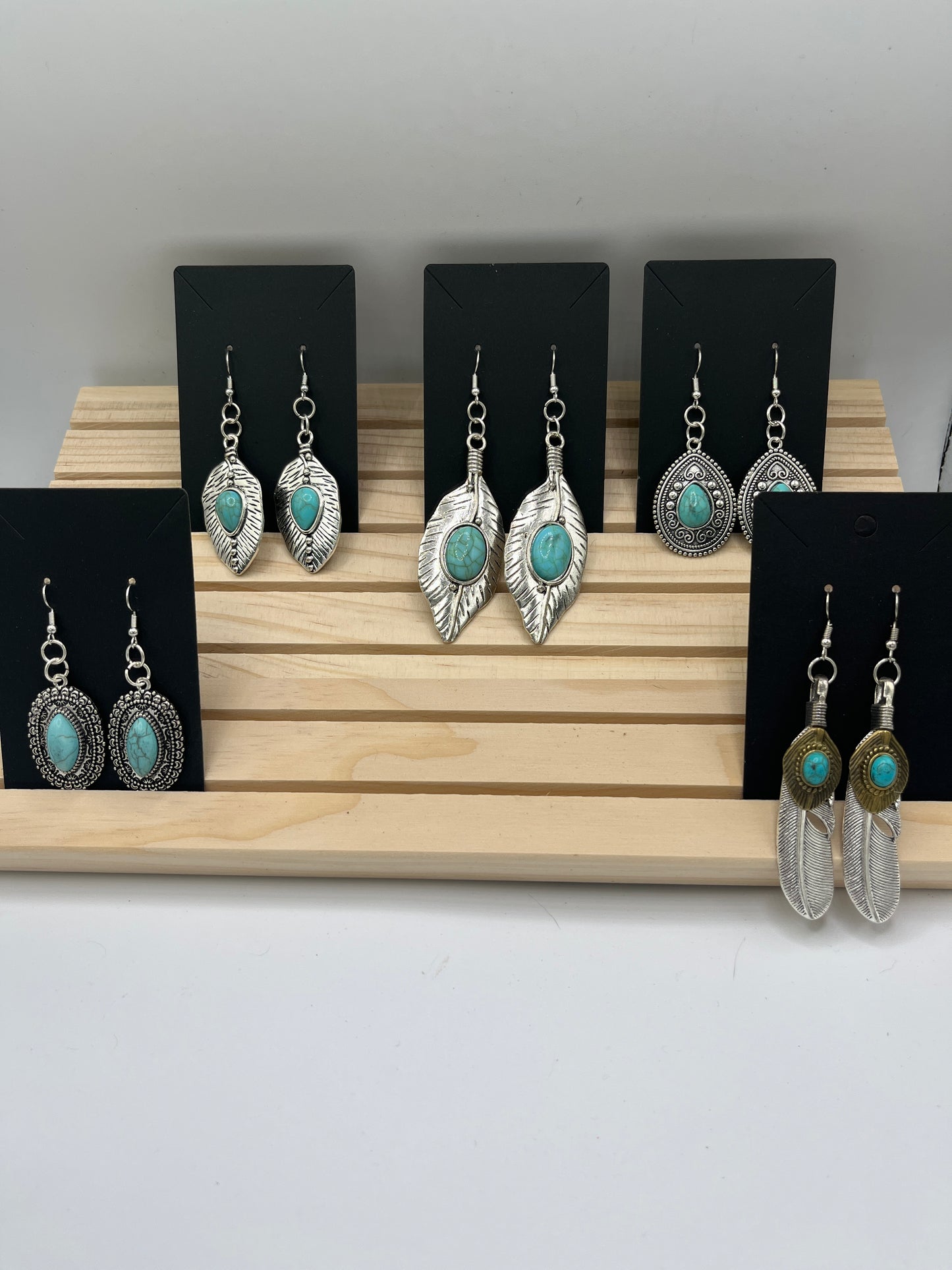 Long Silver tone feather with teardrop turquoise set earrings
