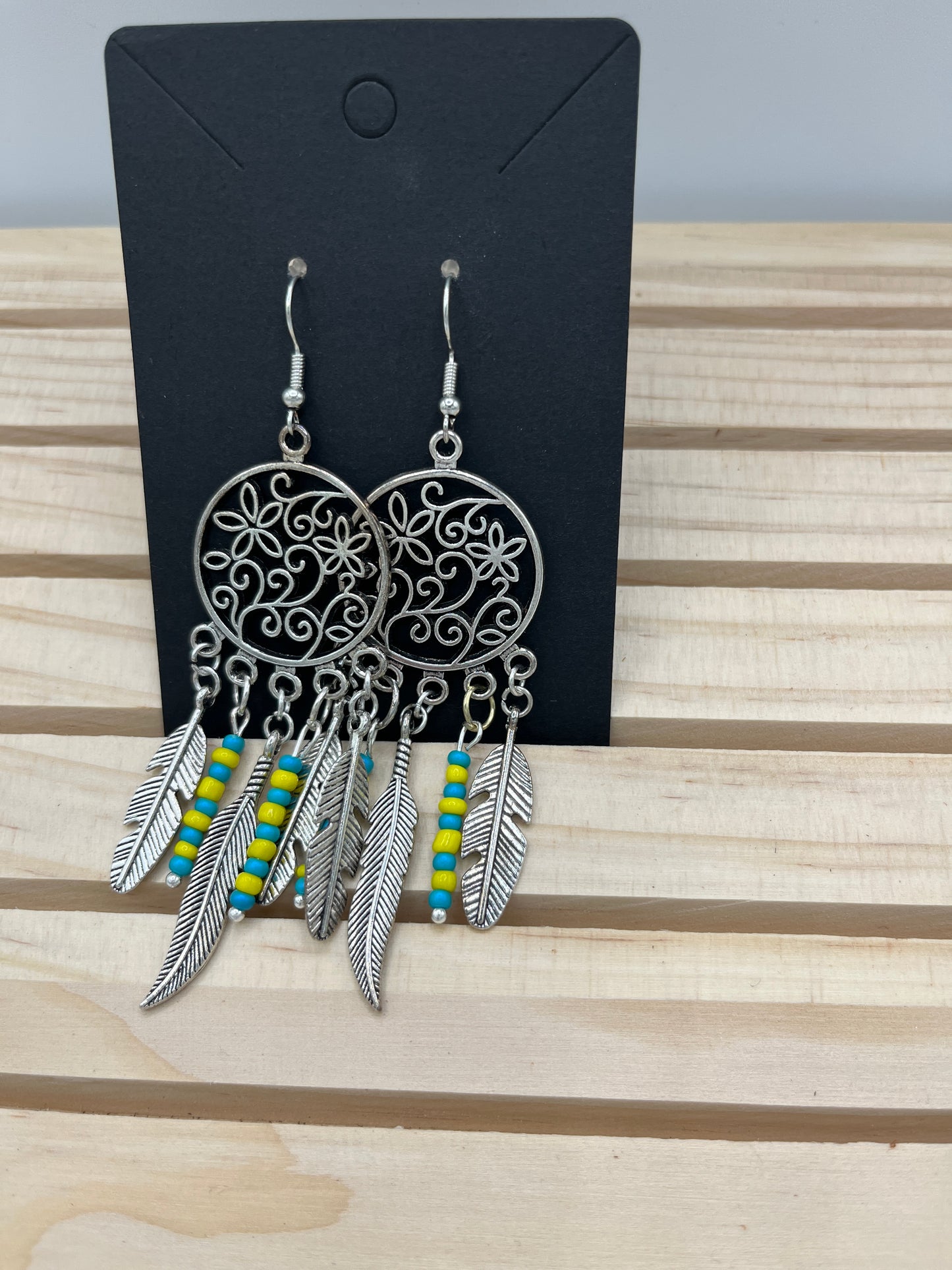 Dreamcatcher with floral design and turquoise and yellow bead earrings