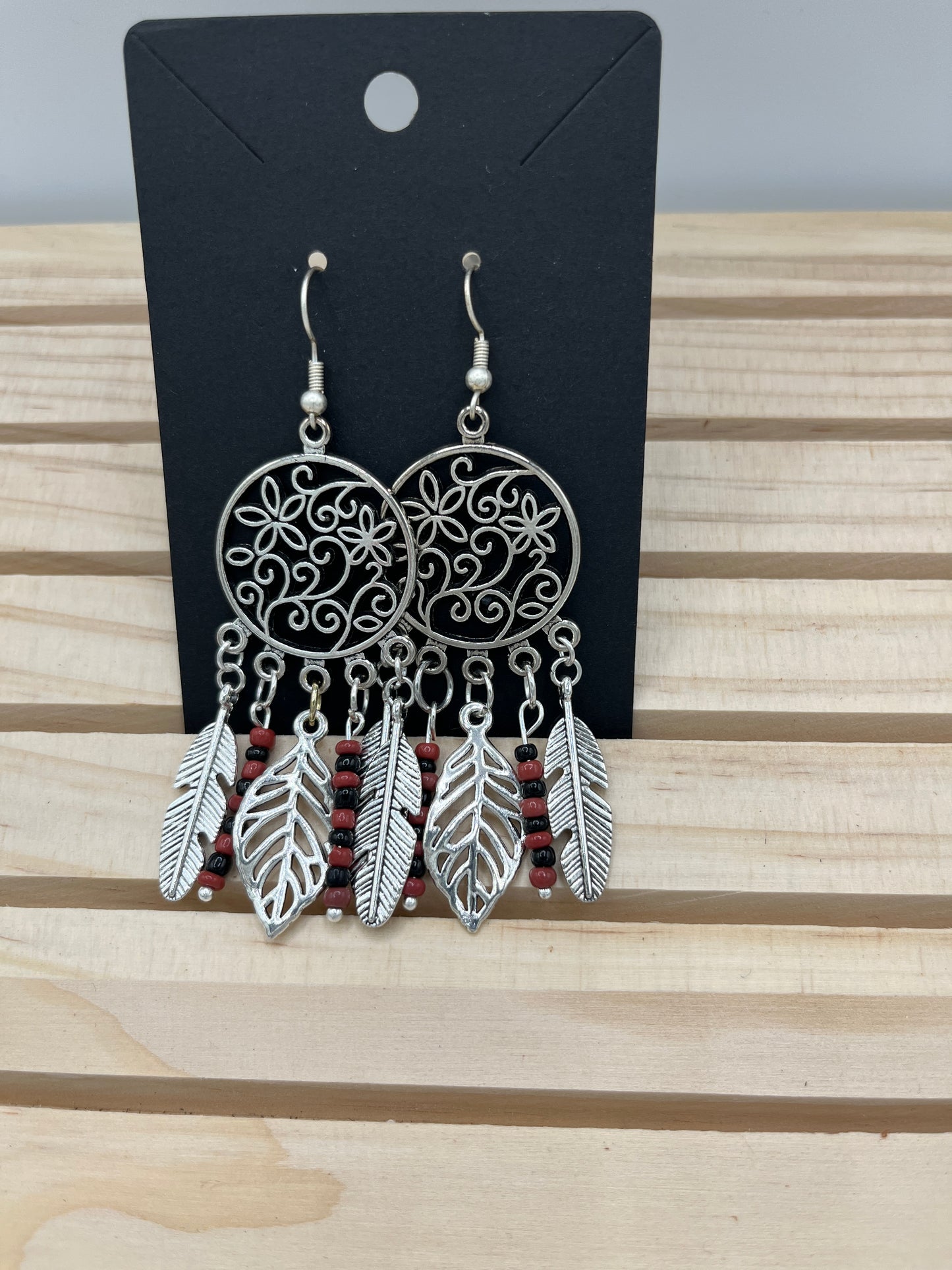 Dreamcatcher with floral inset with rust and black beads earrings
