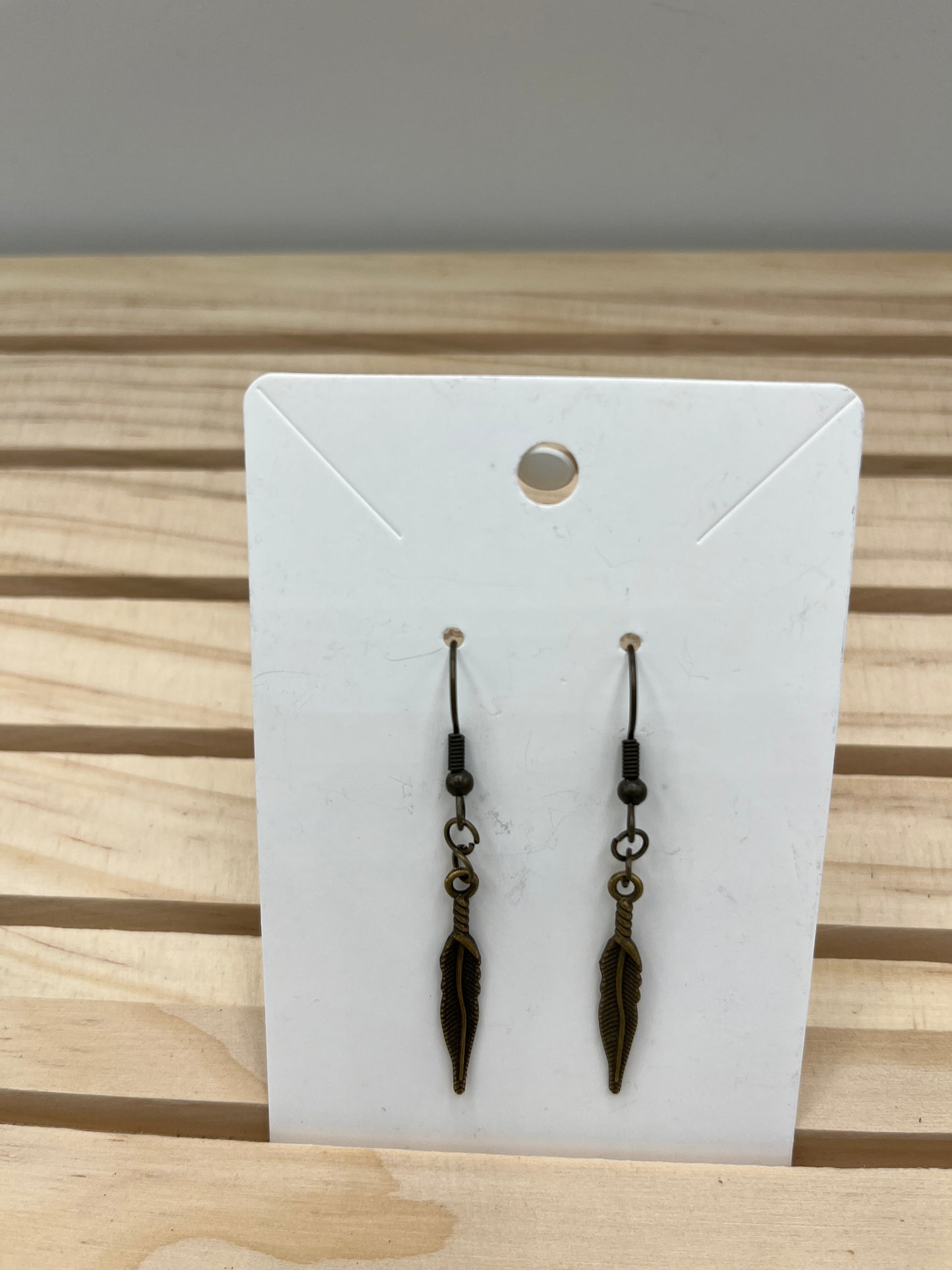 Brass slender feather earrings