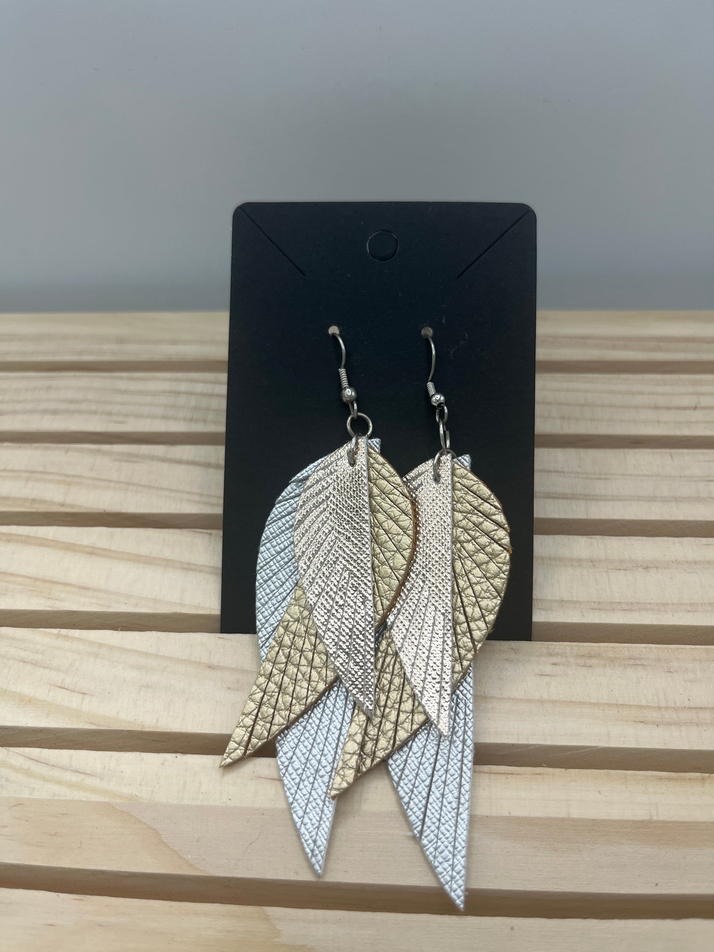 Leather three piece feather earrings