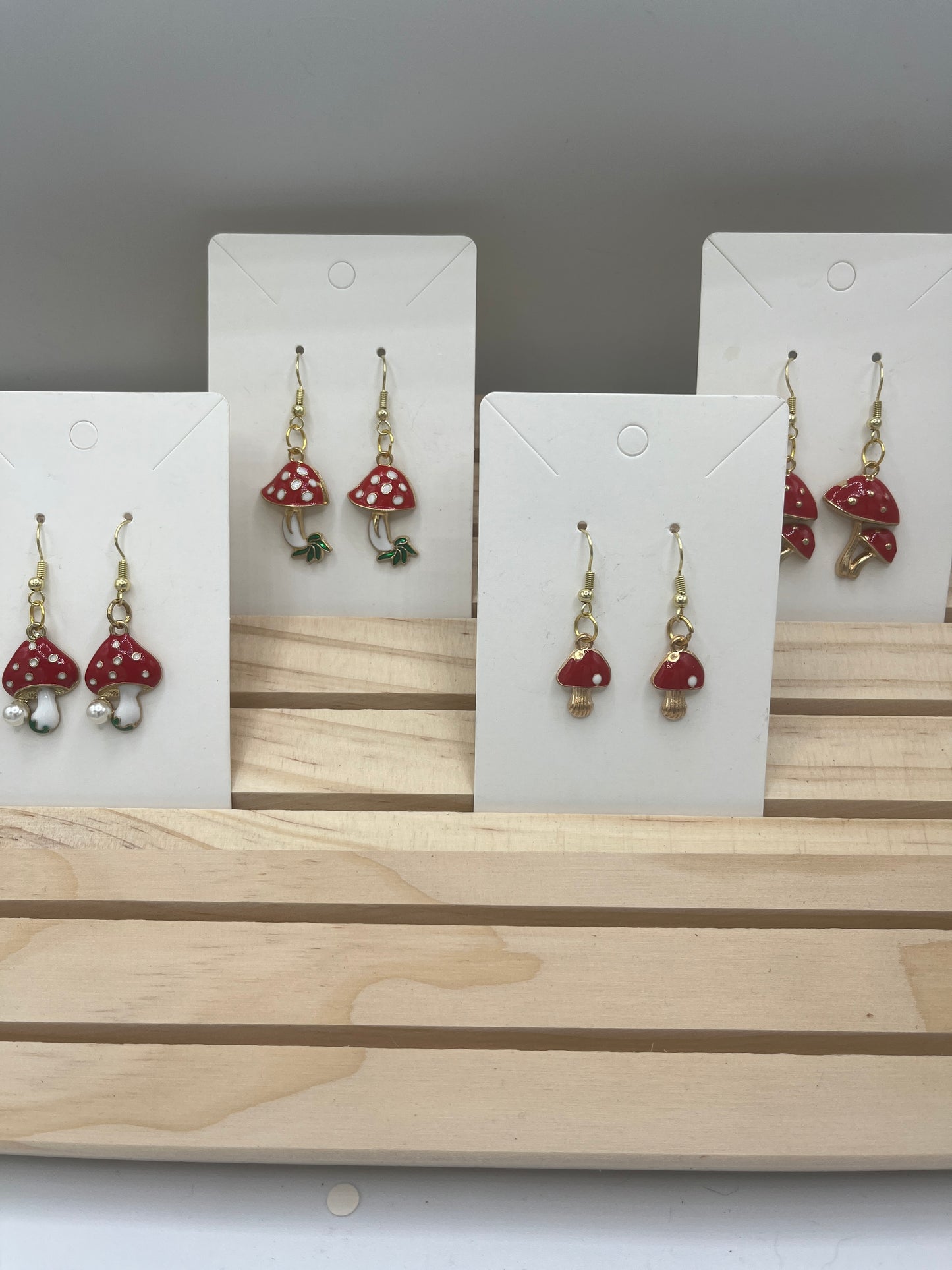Red and white mushroom with leaves earrings