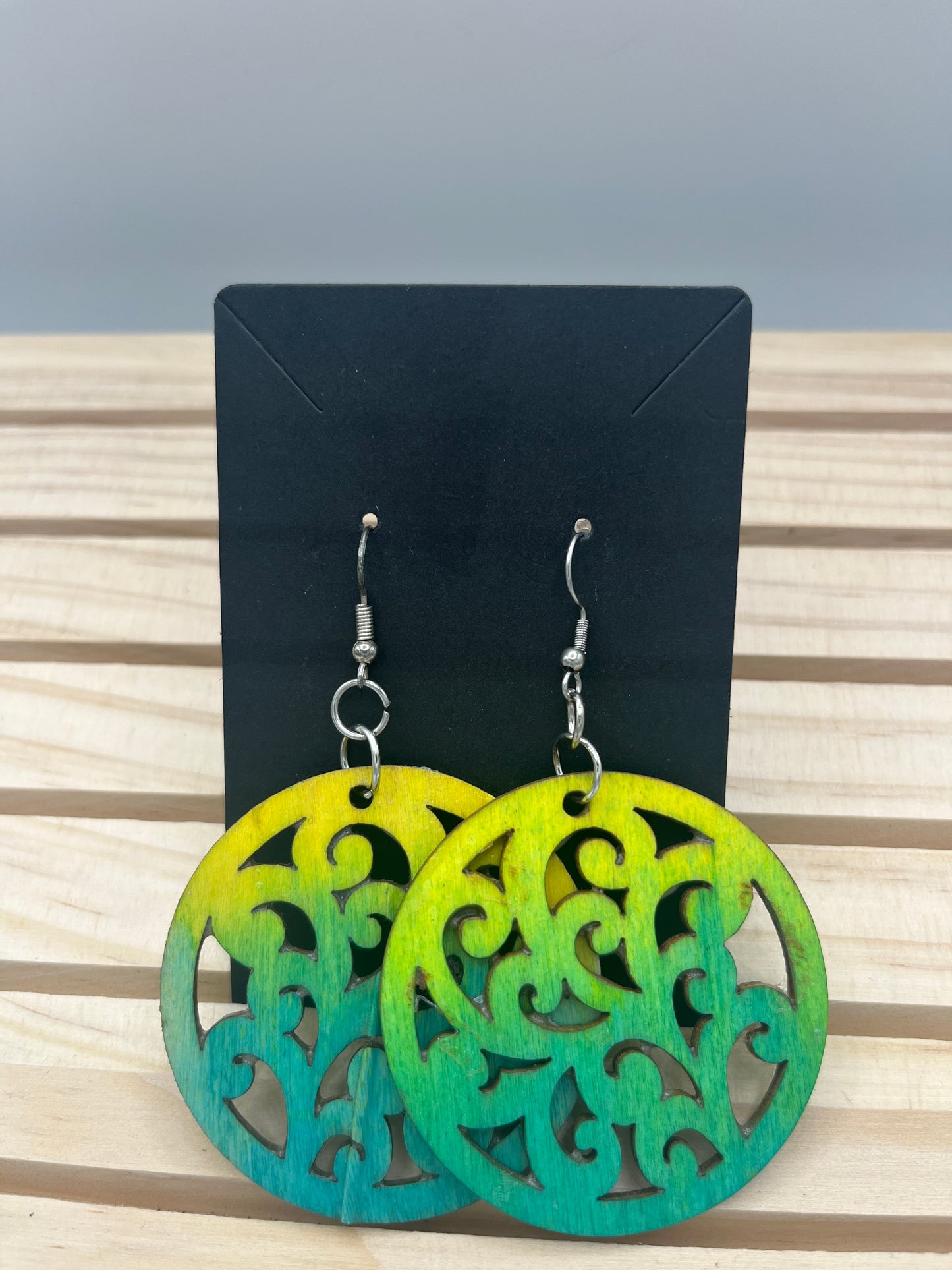 Green and yellow filigree circle earrings