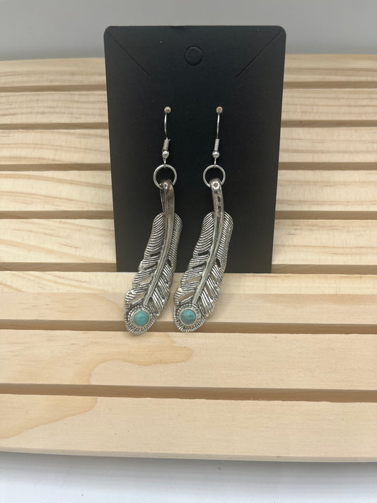 Silver tone curved feather earrings