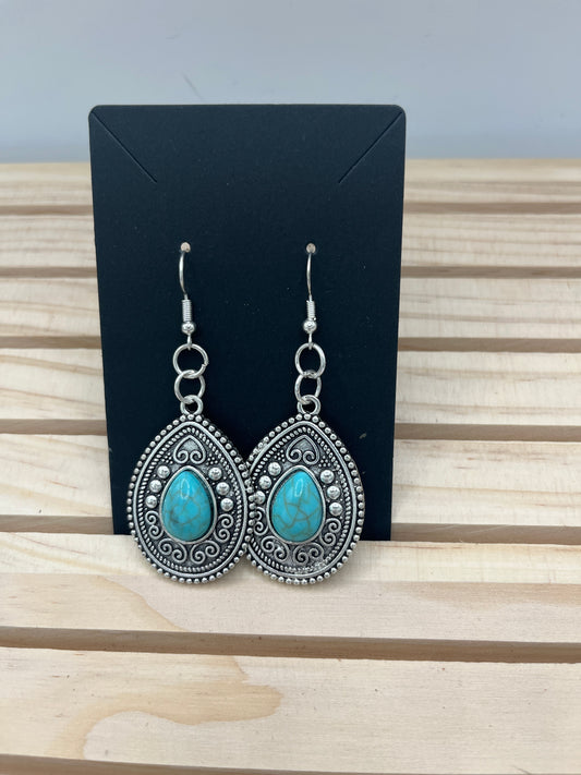 Silver tone teardrop earrings with center turquoise stones and hearts